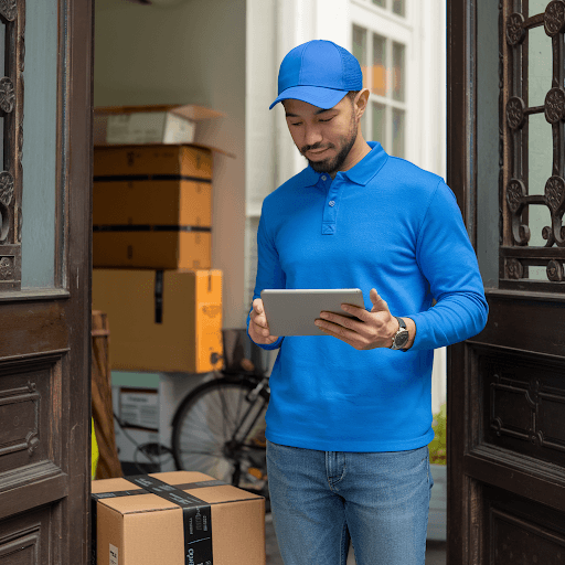 Amazon delivery driver with a tablet in hand